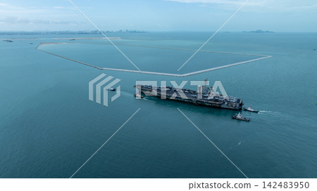 Aerial view nuclear powered aircraft carrier, USA navy ship carrier airplane fighter jet aircraft army navy nuclear ship carrier full fighter jet aircraft technology of battleship. Aerial view nuclear powered aircraft carrier, USA navy ship carrier airplane fighter jet aircraft army navy nuclear ship carrier full fighter jet aircraft technology of battleship. 142483950