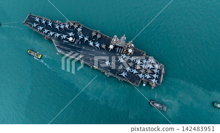 Aerial view nuclear powered aircraft carrier, USA navy ship carrier airplane fighter jet aircraft army navy nuclear ship carrier full fighter jet aircraft technology of battleship. Aerial view nuclear powered aircraft carrier, USA navy ship carrier airplane fighter jet aircraft army navy nuclear ship carrier full fighter jet aircraft technology of battleship. 142483951