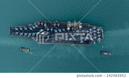 Aerial view nuclear powered aircraft carrier, USA navy ship carrier airplane fighter jet aircraft army navy nuclear ship carrier full fighter jet aircraft technology of battleship. Aerial view nuclear powered aircraft carrier, USA navy ship carrier airplane fighter jet aircraft army navy nuclear ship carrier full fighter jet aircraft technology of battleship. 142483952