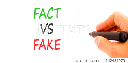 Fact vs versus fake words symbol. Concept words Fact vs Fake on beautiful white paper. Beautiful white background. Businessman hand. Business and fact vs versus fake concept. Copy space. Fact vs versus fake words symbol. Concept words Fact vs Fake on beautiful white paper. Beautiful white background. Businessman hand. Business and fact vs versus fake concept. Copy space. 142484073
