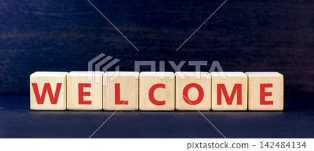 Welcome word symbol. Concept word Welcome on beautiful wooden blocks. Beautiful black table black background. Business welcome word concept. Copy space. Welcome word symbol. Concept word Welcome on beautiful wooden blocks. Beautiful black table black background. Business welcome word concept. Copy space. 142484134
