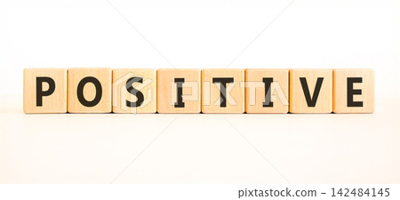 Positive word symbol. Concept word Positive on beautiful wooden blocks. Beautiful white background. Business support help positive word concept. Copy space. Positive word symbol. Concept word Positive on beautiful wooden blocks. Beautiful white background. Business support help positive word concept. Copy space. 142484145