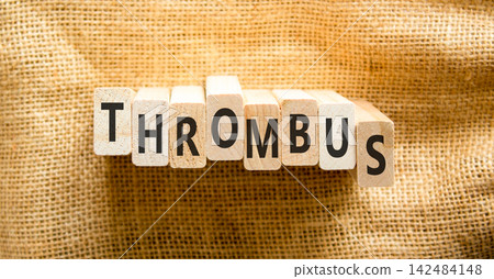 Thrombus word symbol. Concept word Thrombus on beautiful wooden blocks. Beautiful canvas background. Business medical support help thrombus word concept. Copy space. Thrombus word symbol. Concept word Thrombus on beautiful wooden blocks. Beautiful canvas background. Business medical support help thrombus word concept. Copy space. 142484148