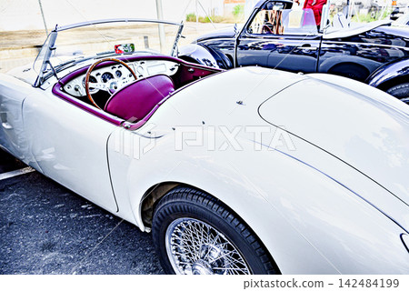 Classic car exhibition, a gleaming white MG MGA. Classic car exhibition, a gleaming white MG MGA. 142484199