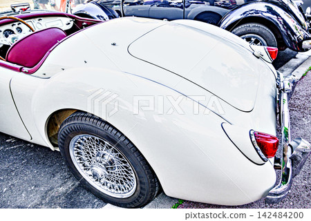 Classic car exhibition, a gleaming white MG MGA. Classic car exhibition, a gleaming white MG MGA. 142484200