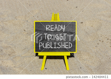 Ready to get published words symbol. Concept words Ready to get published on beautiful black blackboard. Beautiful sand background. Business ready to get published motivational concept. Copy space. Ready to get published words symbol. Concept words Ready to get published on beautiful black blackboard. Beautiful sand background. Business ready to get published motivational concept. Copy space. 142484411