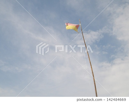 Red and yellow flag Red and yellow flag 142484669