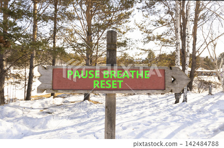 Pause breathe reset words symbol. Concept words Pause breathe reset on beautiful road sign. Beautiful winter forest background. Business support motivational pause breathe reset concept. Copy space. Pause breathe reset words symbol. Concept words Pause breathe reset on beautiful road sign. Beautiful winter forest background. Business support motivational pause breathe reset concept. Copy space. 142484788