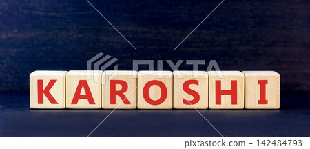 Karoshi word symbol. Concept word Karoshi on beautiful wooden blocks. Beautiful black table black background. Business medical Karoshi word concept. Copy space. Karoshi word symbol. Concept word Karoshi on beautiful wooden blocks. Beautiful black table black background. Business medical Karoshi word concept. Copy space. 142484793