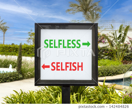 Selfless instead selfish words symbol. Concept words Selfless Selfish on beautiful white road sign. Beautiful palm trees background. Business medical psychology selfless selfish concept. Copy space. Selfless instead selfish words symbol. Concept words Selfless Selfish on beautiful white road sign. Beautiful palm trees background. Business medical psychology selfless selfish concept. Copy space. 142484826