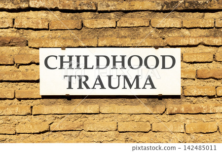 Childhood trauma words symbol. Concept words Childhood trauma on beautiful white sign plate. Beautiful brown brick wall background. Psychological childhood trauma support concept. Copy space. Childhood trauma words symbol. Concept words Childhood trauma on beautiful white sign plate. Beautiful brown brick wall background. Psychological childhood trauma support concept. Copy space. 142485011