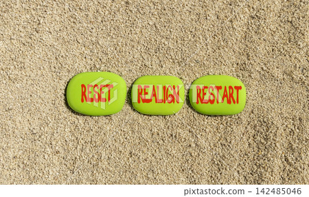 Reset realign restart words symbol. Concept words Reset realign restart on beautiful green stones. Beautiful sand background. Business motivational and reset realign restart concept. Copy space. Reset realign restart words symbol. Concept words Reset realign restart on beautiful green stones. Beautiful sand background. Business motivational and reset realign restart concept. Copy space. 142485046