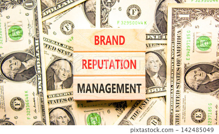 Brand reputation management symbol. Concept words Brand reputation management on beautiful wooden blocks. Beautiful dollar bills background. Business brand reputation management concept. Copy space. Brand reputation management symbol. Concept words Brand reputation management on beautiful wooden blocks. Beautiful dollar bills background. Business brand reputation management concept. Copy space. 142485049