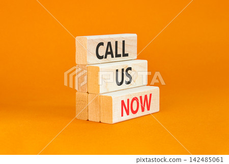Call us now words symbol. Concept words Call us now on beautiful wooden blocks. Beautiful orange background. Business support motivational and call us now concept. Copy space. Call us now words symbol. Concept words Call us now on beautiful wooden blocks. Beautiful orange background. Business support motivational and call us now concept. Copy space. 142485061