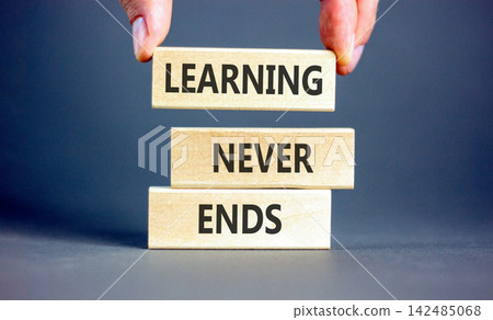 Learning never ends words symbol. Concept words Learning never ends on beautiful wooden blocks. Beautiful grey background. Business support motivational and learning never ends concept. Copy space. Learning never ends words symbol. Concept words Learning never ends on beautiful wooden blocks. Beautiful grey background. Business support motivational and learning never ends concept. Copy space. 142485068