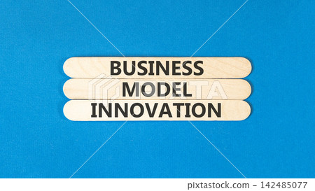 Business model innovation words symbol. Concept words Business model innovation on beautiful wooden sticks. Beautiful blue background. Business model innovation concept. Copy space. Business model innovation words symbol. Concept words Business model innovation on beautiful wooden sticks. Beautiful blue background. Business model innovation concept. Copy space. 142485077