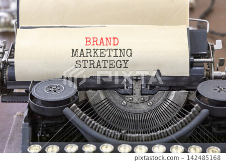 Brand marketing strategy words symbol. Concept words Brand marketing strategy typed on beautiful old retro typewriter. Beautiful white background. Business brand marketing strategy concept. Copy space Brand marketing strategy words symbol. Concept words Brand marketing strategy typed on beautiful old retro typewriter. Beautiful white background. Business brand marketing strategy concept. Copy space 142485168