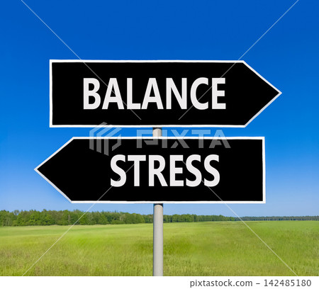Balance instead stress words symbol. Concept words Balance Stress on beautiful black road sign. Beautiful blue sky background. Business medical psychology balance stress concept. Copy space. Balance instead stress words symbol. Concept words Balance Stress on beautiful black road sign. Beautiful blue sky background. Business medical psychology balance stress concept. Copy space. 142485180