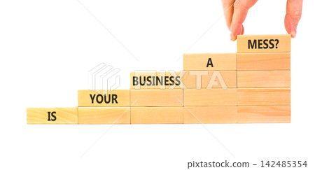Is your business a mess symbol. Concept words Is your business a mess on beautiful wooden blocks. Beautiful white background. Businessman hand. Is your business a mess concept. Copy space. Is your business a mess symbol. Concept words Is your business a mess on beautiful wooden blocks. Beautiful white background. Businessman hand. Is your business a mess concept. Copy space. 142485354