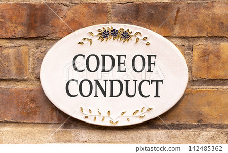 Code of conduct words symbol. Concept words Code of conduct on beautiful white sign plate. Beautiful brown brick wall background. Business Code of conduct concept. Copy space. Code of conduct words symbol. Concept words Code of conduct on beautiful white sign plate. Beautiful brown brick wall background. Business Code of conduct concept. Copy space. 142485362