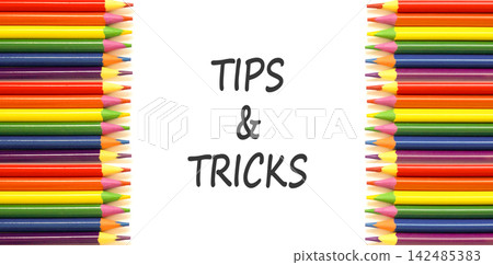 Tips and tricks words symbol. Concept words Tips and tricks on beautiful white paper. Beautiful white background. Colored pencils. Business tips and tricks motivational support concept. Copy space. Tips and tricks words symbol. Concept words Tips and tricks on beautiful white paper. Beautiful white background. Colored pencils. Business tips and tricks motivational support concept. Copy space. 142485383