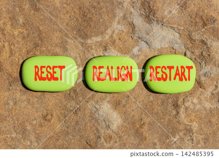 Reset realign restart words symbol. Concept words Reset realign restart on beautiful green stones. Beautiful stone background. Business motivational and reset realign restart concept. Copy space. 142485395