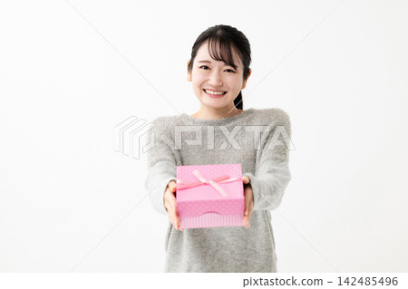 Woman with gift Woman with gift 142485496