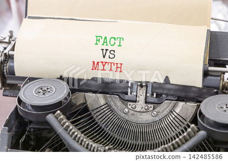 Fact vs versus myth words symbol. Concept words Fact vs Myth typed on beautiful old retro typewriter. Beautiful white background. Business and fact vs versus myth concept. Copy space. Fact vs versus myth words symbol. Concept words Fact vs Myth typed on beautiful old retro typewriter. Beautiful white background. Business and fact vs versus myth concept. Copy space. 142485586