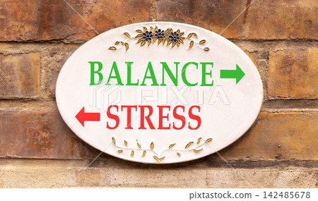 Balance instead stress words symbol. Concept words Balance Stress on beautiful white sign plate. Beautiful brick wall background. Business medical psychology balance stress concept. Copy space. Balance instead stress words symbol. Concept words Balance Stress on beautiful white sign plate. Beautiful brick wall background. Business medical psychology balance stress concept. Copy space. 142485678