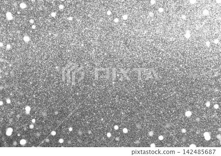 Silver glitter background with sparkling bokeh for festive and glamorous holiday design projects Silver glitter background with sparkling bokeh for festive and glamorous holiday design projects 142485687