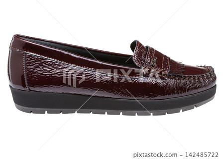 Dark burgundy patent leather womens loafer isolated on white background. Casual platform moccasin side view Dark burgundy patent leather womens loafer isolated on white background. Casual platform moccasin side view 142485722