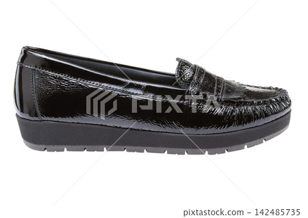 Black patent leather womens loafer isolated on white background. Casual platform moccasin side view Black patent leather womens loafer isolated on white background. Casual platform moccasin side view 142485735