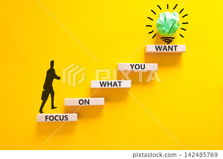 Focus on what you want symbol. Concept words Focus on what you want on beautiful wooden blocks. Beautiful yellow background. Psychologist icon. Psychological focus on what you want concept. Copy space Focus on what you want symbol. Concept words Focus on what you want on beautiful wooden blocks. Beautiful yellow background. Psychologist icon. Psychological focus on what you want concept. Copy space 142485769
