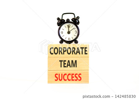 Corporate team success words symbol. Concept words Corporate team success on beautiful wooden blocks. Beautiful white background. Black alarm clock. Business corporate team success concept Copy space 142485830