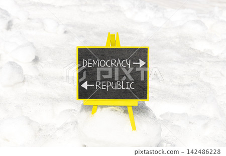 Democracy or republic words symbol. Concept words Democracy Republic on beautiful yellow blackboard. Beautiful white snow background. Business democracy republic concept. Copy space Democracy or republic words symbol. Concept words Democracy Republic on beautiful yellow blackboard. Beautiful white snow background. Business democracy republic concept. Copy space 142486228