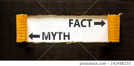 Fact or myth words symbol. Concept words Myth and Fact on beautiful white paper. Beautiful black background. Business and fact or myth concept. Copy space. Fact or myth words symbol. Concept words Myth and Fact on beautiful white paper. Beautiful black background. Business and fact or myth concept. Copy space. 142486235
