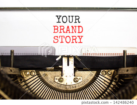Branding and your brand story symbol. Concept words Your brand story typed on beautiful old retro typewriter. Beautiful white background. Business branding your brand story concept. Copy space. Branding and your brand story symbol. Concept words Your brand story typed on beautiful old retro typewriter. Beautiful white background. Business branding your brand story concept. Copy space. 142486240