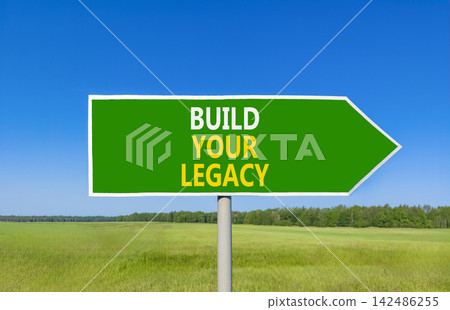 Build your legacy words symbol. Concept words Build your legacy on beautiful green road sign. Beautiful blue sky green grass background. Business build your legacy concept. Copy space. 142486255