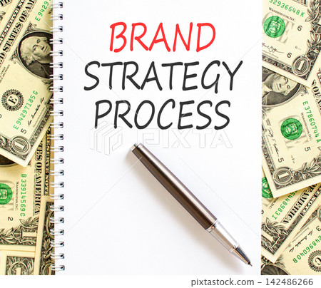 Brand strategy process words symbol. Concept words Brand strategy process on beautiful white note. Beautiful dollar bills background. Business and brand strategy process concept. Copy space. Brand strategy process words symbol. Concept words Brand strategy process on beautiful white note. Beautiful dollar bills background. Business and brand strategy process concept. Copy space. 142486266