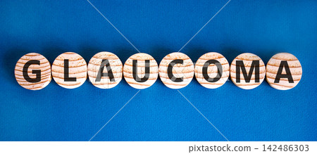 Glaucoma word symbol. Concept word Glaucoma on beautiful wooden circles. Beautiful blue background. Medical support help glaucoma word concept. Copy space. Glaucoma word symbol. Concept word Glaucoma on beautiful wooden circles. Beautiful blue background. Medical support help glaucoma word concept. Copy space. 142486303