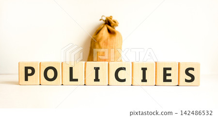 Policies word symbol. Concept word Policies on beautiful wooden blocks. Beautiful white background. Beautiful canvas bag. Business support help policies word concept. Copy space. Policies word symbol. Concept word Policies on beautiful wooden blocks. Beautiful white background. Beautiful canvas bag. Business support help policies word concept. Copy space. 142486532