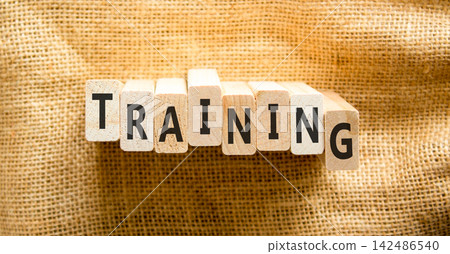 Training word symbol. Concept word Training on beautiful wooden blocks. Beautiful canvas background. Business support help training word concept. Copy space. Training word symbol. Concept word Training on beautiful wooden blocks. Beautiful canvas background. Business support help training word concept. Copy space. 142486540