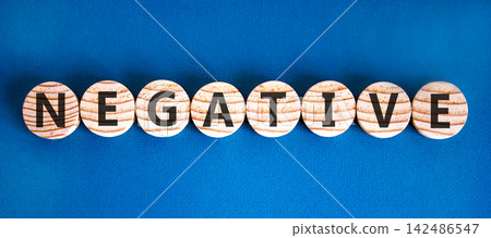 Negative word symbol. Concept word Negative on beautiful wooden circles. Beautiful blue background. Business support help negative word concept. Copy space. 142486547