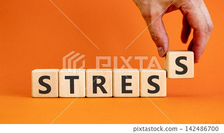 Stress word symbol. Concept word Stress on beautiful wooden blocks. Beautiful orange background. Psychologist's hand. Business psychological medical stress word concept. Copy space. Stress word symbol. Concept word Stress on beautiful wooden blocks. Beautiful orange background. Psychologist's hand. Business psychological medical stress word concept. Copy space. 142486700