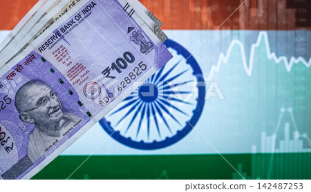 Indian 100 rupee banknotes placed on Indian flag Background Indian 100 rupee banknotes placed on Indian flag Background 142487253