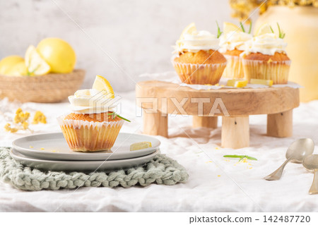 Fresh homemade lemon cupcakes with cream frosting 142487720