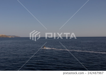 Motorboat speed boat sailing in open Mediterranean sea leaving white wake trail,Malta, June 19, 2026 Motorboat speed boat sailing in open Mediterranean sea leaving white wake trail,Malta, June 19, 2026 142487967