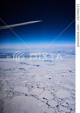 The Arctic as seen from an airplane, sky The Arctic as seen from an airplane, sky 142488231