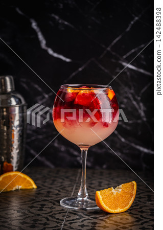 Glass of red wine spanish cocktail 142488398