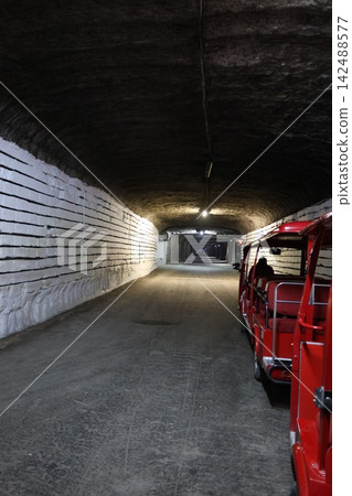 Underground tour vehicle, storing wine in a cellar. High quality 4k footage Underground tour vehicle, storing wine in a cellar. High quality 4k footage 142488577